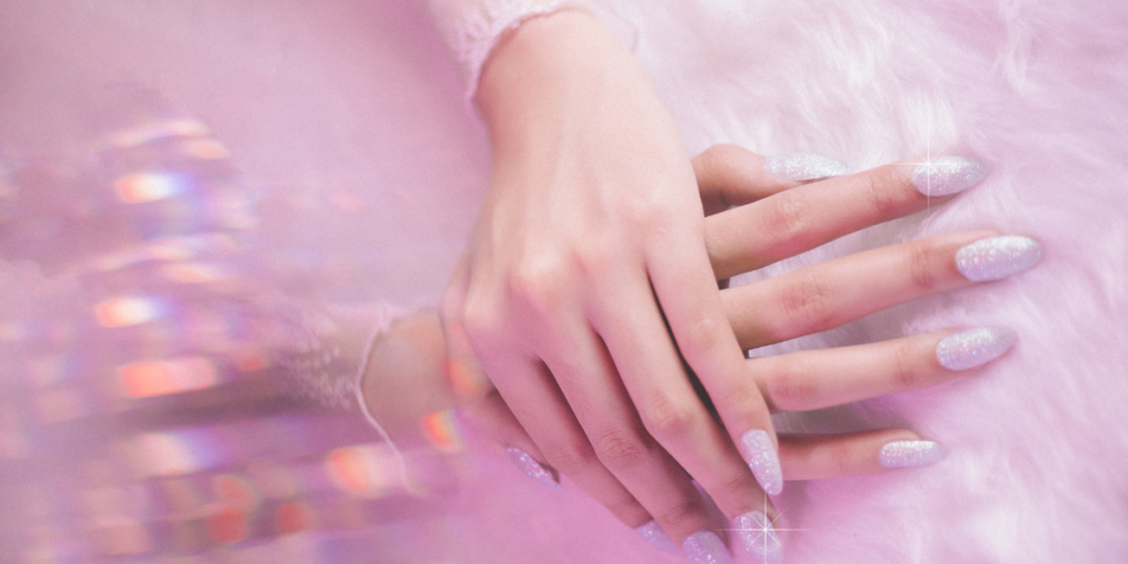 Nail extension application using a form with gloved hands.